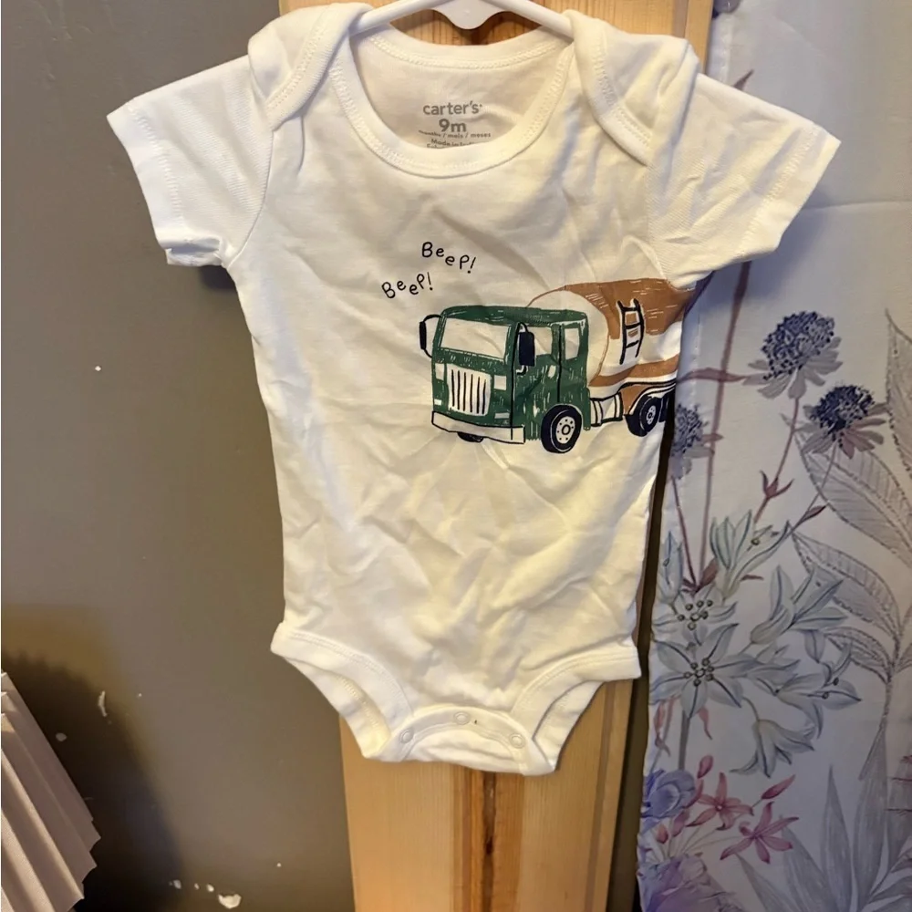 Carter's Cream Bodysuit with Animal Design.  5 size 9 months onesies for $15
